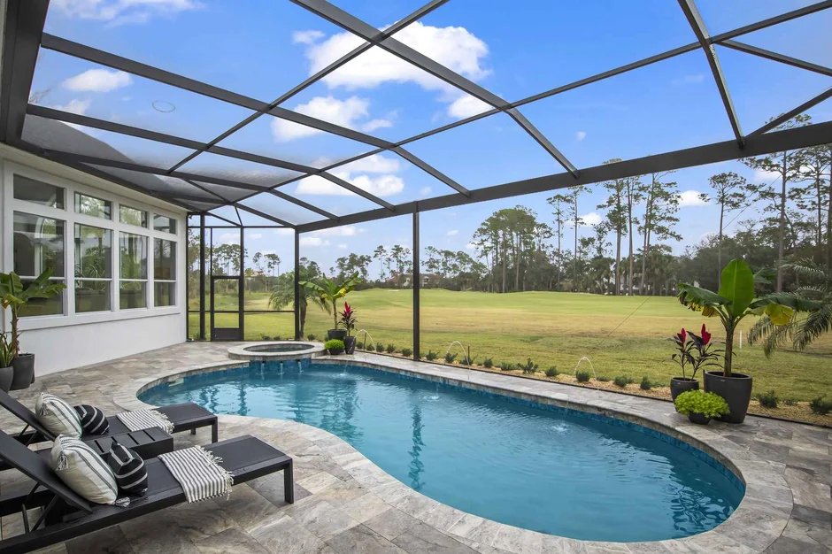 Custom pool enclosure construction over backyard swimming pool in Lakeland, FL