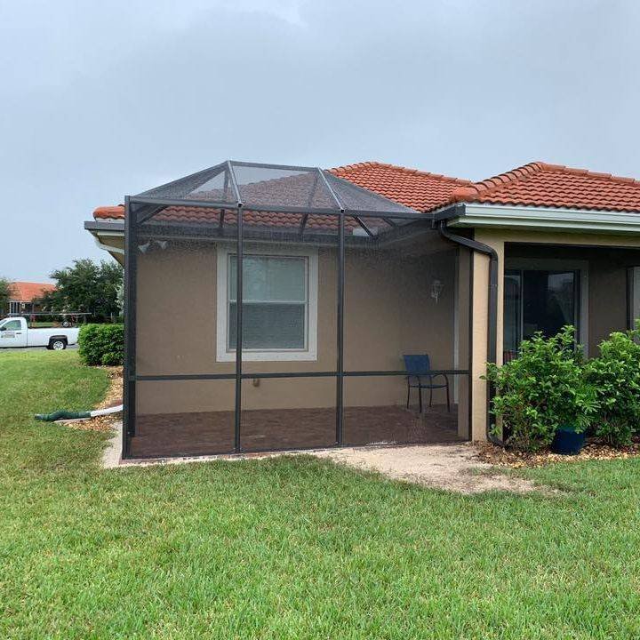 Screened patio extension attached to single-story home in Lakeland, FL